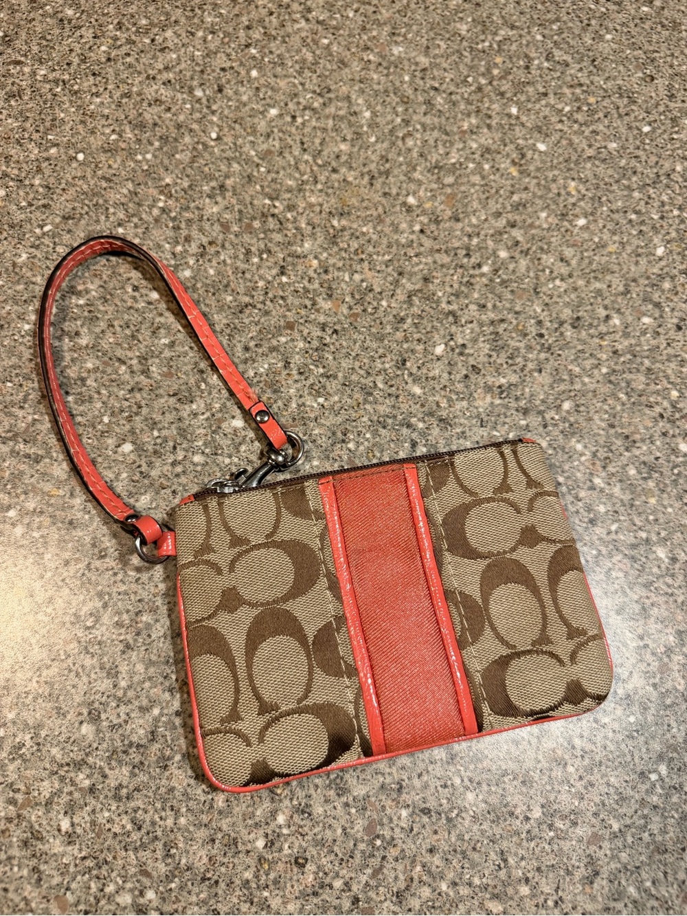 Coach Signature Monogram Wristlet in Brown and Coral